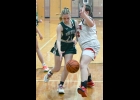 JOSIE WIELAND (#11) drivers around the Beaverton player in last Thursday’s loss to the Beavers. --Journal Photo