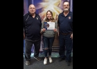 Addison Cooley (center) is recognized, by The Knights of Columbus in Pinconning, for being chosen runner up in the Keep Christ in Christmas poster contest. Miss Cooley’s poster won First Place at the Council level and First at the District level. The top two posters in each state will now be considered for international competition. Presenting the certificate is District Deputy Ray Skrabut (left) and Grand Knight Al Guzdial (right). --Courtesy Photo