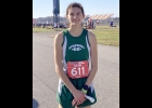 KINSIE JACQUES poses in the infield at Michigan International Speedway before running to 33rd place out of 247 competitors at the MHSAA Division 3 Girls Cross Country State Finals. --Courtesy Photo