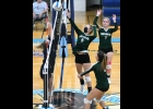 KALLIE BLAKE (#5) taps the ball back over the net for a point against Meridian. --Journal Photo