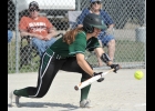KATE FOOR (#8) lays down a bunt against Gladwin during the first game last Thursday. --Journal Photo