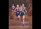 KINSIE JACQUES leads a pack through the woods earlier this year. The freshman captured the Bay County Cross-Country Championship, finished fifth in the Jack Pine Conference, first in her MHSAA Pre-Regional and second in the Regional last Saturday to qualify for the State Championship this Saturday at Michigan International Speedway. --Courtesy Photo