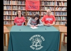 KINSIE JACQUES, with her parents by her side, signs a National Letter of Intent with Saginaw Valley State University to continue her running career as part of their Cross Country, Indoor Track, and Track and Field programs this fall. Jacques hold the Pinconning High School records in Cross Country, and 1- and 2-mile run. She is a four-time State Finalist in Cross Country and earned All-State honors three consecutive times. She also qualified for the State Finals twice in Track (with this year’s season yet t