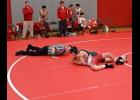 LANDEN ENCISO watches the referee signal a fall to give him his first Varsity wrestling win last Wednesday at MLS. --Journal Photo