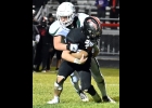 LANDIN BARGERON (#55) takes down the Cavalier’s QB for a sack in Friday’s 35-12 season-ending win in Carrollton.
