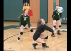 LAURA LAVRACK (#2, above) digs out the ball against Harrison last Wednesday as Daylin Bayne (#10) and Brielle Herner (#8) look on. --Journal Photo