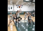 LAUREN LAURES (#3) goes in for a layup as (from left) Grace Floyd (#20), Brielle Herner (#10), and Raven Wieland (#11) work to give her a lane during last Wednesday’s 53-34 loss to the Panthers of Standish-Sterling Central. --Journal Photo