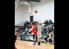 LOGAN CHANT (#5) gets an outside shot late in the Spartans 72-51 win over the Cardinals of Whittemore-Prescott last Wednesday. --Journal Photo