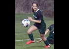 MADDY GRZEGORCZYK (#3, right) chases down the ball during Thursday’s game against Oscoda. --Journal Photo
