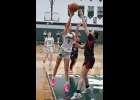 MAGGIE HISTED (#3, right top) goes up for 2 of her 6 points against St. Louis last week. Pinny lost to the Sharks 52-27.