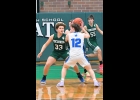 marcus pickett (#33) challenges a Beal City player on defense early in Pinconning’s District Final loss to Beal City last Thursday.