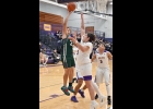 marcus pickett (#33, left) battles to turn a rebound into 2 of his 6 points in the Spartans’ win over the Wolves on Monday night.