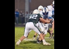 MAX CIANEK (#52) lines up the Gladwin ball-carrier for one of his four tackles on Friday. --Journal Photo