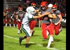 NOLAN RESZKE (#6) hauls down the St. Louis ball-carrier late in the Spartans’ 0-3 road loss on Friday night. --Journal Photo