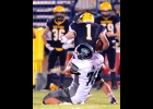 OLIVER CIANEK (#71) hauls down the Panthers ball-carrier during Thursday night’s game against SSC. --Journal Photo
