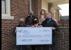 Friends of the Pinconning Community Center are seen as they accept a donation from the Oscar P. and Louise H. Osthelder Advisory Fund at the Bay Area Community Foundation. Pictured are Bob Charlebois, Jessica Holland, Dan Lapan, Dennis Curtis and Ellen Charliebois. 	                             --Courtesy Photo
