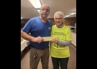 PAUL POMAVILLE of the Pinconning Goodfellows presents Judy Fenwick with a check for $1000 for the Pinconning Area Emergency Food Pantry. -- Courtesy photo