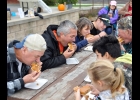 PIE EATERS young and old took part in the Pumpkin Pie Eating Contest on Saturday. Albert Schanck won this year’s contest.       		 --Journal Photo