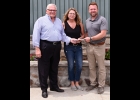 DAVE AND ANNIE RAMSAY present Pinconning & Linwood Chamber of Commerce President Josh Klee with a check for $5,000 for the CheeseTown Festival Fireworks Show. --Journal Photo