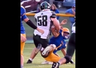 RILEY HILL(#58) clearly caused a fumble with this sack (ball is visible behind the Harrison QB) but when a Spartan player nudged the ball out of bounds, it was called as a fumble out of bounds and Harrison retained possession. --Journal Photo