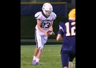 Ryan Kowalczyk (#23) makes one of his five punts on Friday, averaging over 32.5 yards per kick.   