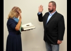 TERRY SPENCER (right) is sworn in as Pinconning Police Chief by Pinconning City Manager/Clerk Becky Lakin after Monday evening’s City Council meeting.       										 --Journal Photo