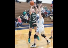 SUMMER POMAVILLE (#20) takes a shot against Bay City All-Saints on Monday. --Journal Photo
