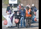 STUDENTS FROM ST. MICHAEL’S SCHOOL made their annual trek through downtown Pinconning on Tuesday, collection Halloween Candy from businesses and a few residences along the way. --Journal Photos