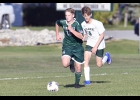 TOMMY GRZEGORCZYK (#16) brings the ball up the right side in last week’s game against the Pioneers. Pinny tied Clare 4-4.