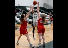 TORI SHARK (#23) fights the Beaverton defense to get the shot away for 2 of her 16 points in the Spartans 35-56 loss to the Beavers last Tuesday. --Journal Photo