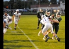 TRISTAN DYCEWICZ (#15) knocks a third Gladwin defender out of his way after catching a Tommy Yanoski pass for an 11-yard gain in Friday’s 37-20 Homecoming loss. --Journal Photo