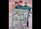 TYLER BROOKS (left) celebrates his 100th Win as a Spartan wrestler, in Gaylord with Coach Hoisington on Saturday. --Journal Photo