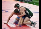 TYLER BROOKS (in green) in action at the MHSAA Individual State Wrestling Championships on Friday. Brooks fell to eventual State Champion Kevin McKiernan 0-4 in this match. --Journal Photo