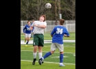 TYLER FLOYD, #11, heads the ball away from the Gladwin player during the Spartans 4-1 loss to the Flying G’s on Saturday at Alpena. --Journal Photo by Colleen Dybas