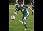 WYATT EDWARDS (#10) sends the ball out on the sideline to stop an Oscoda push late in Monday’s game. --Journal Photo