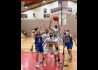 ZACH JOHNSON (#21) goes in for his 1,000th point during Thursday’s District Semi-Final game against Harrison. He’s the first in Pinconning Boys Basketball history to reach the milestone. --Journal Photo