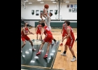 ZACH JOHNSON (#21) is surrounded by all five Beaverton players in the Spartan’s hard-fought loss to the Beavers on Saturday, 61-50. --Journal Photo