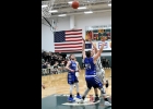 ZACH JOHNSON (#21) slapped an inbound pass from Tommy Yanoski towards the basket with .8 seconds left in the first quarter against Gladwin on Friday, scoring to give the Spartans a 15-12 lead going into the second. --Journal Photo by Kayla Dybas
