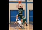 TOMMY YANOSKI (#33) leaps up to intercept a last -second, full-court pass by the Flying G’s to seal the Spartan’s 76-73 win last Thursday. Yanoski has 21 points in the effort.		            --Journal Photo